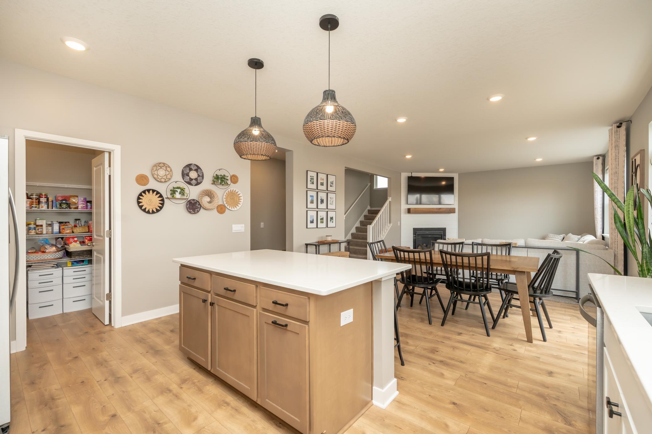 View from your kitchen into your walk-in pantry, dining, living and stairs that lead you to all 5 bedrooms