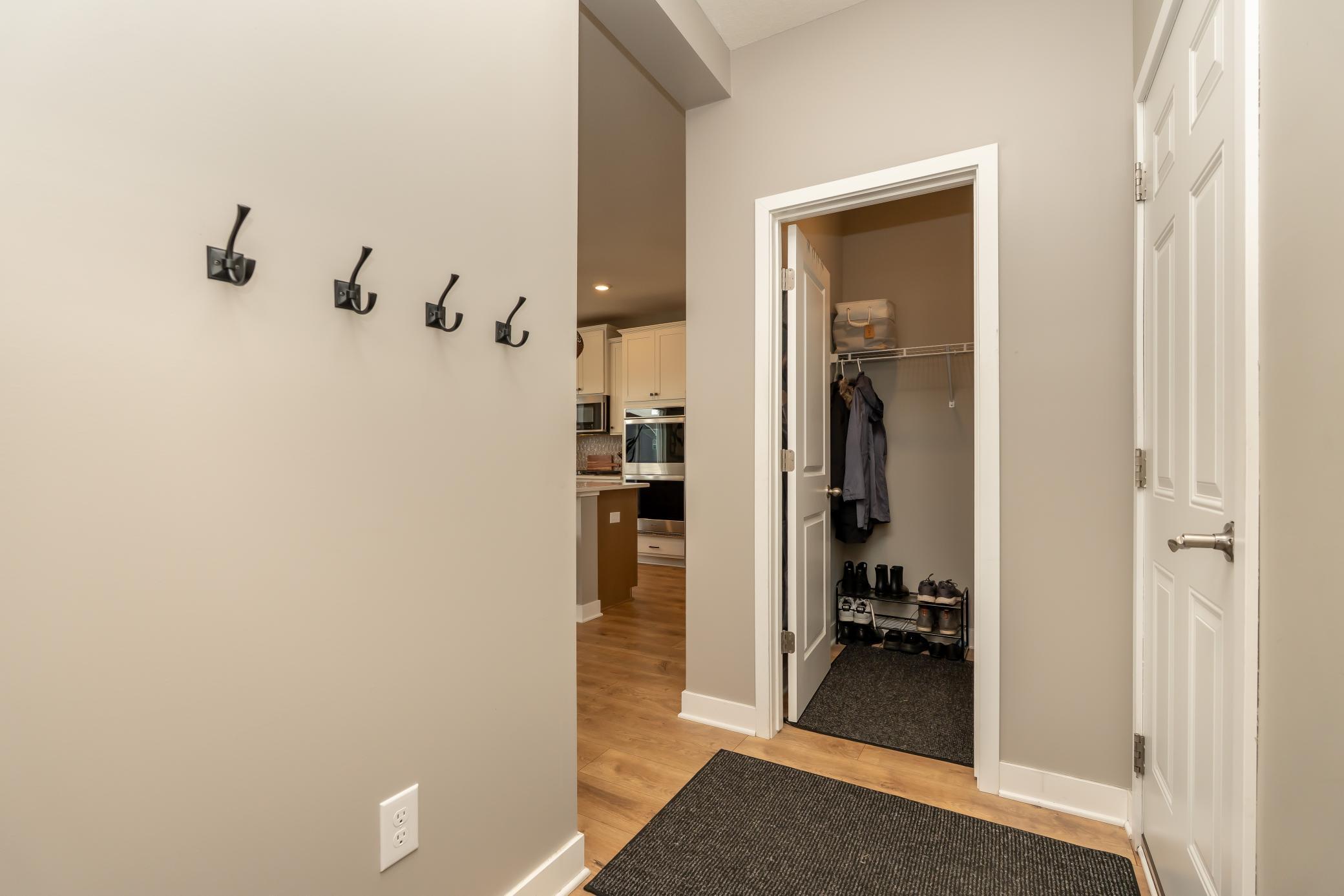 Coat closet steps from your garage and across from the locker system