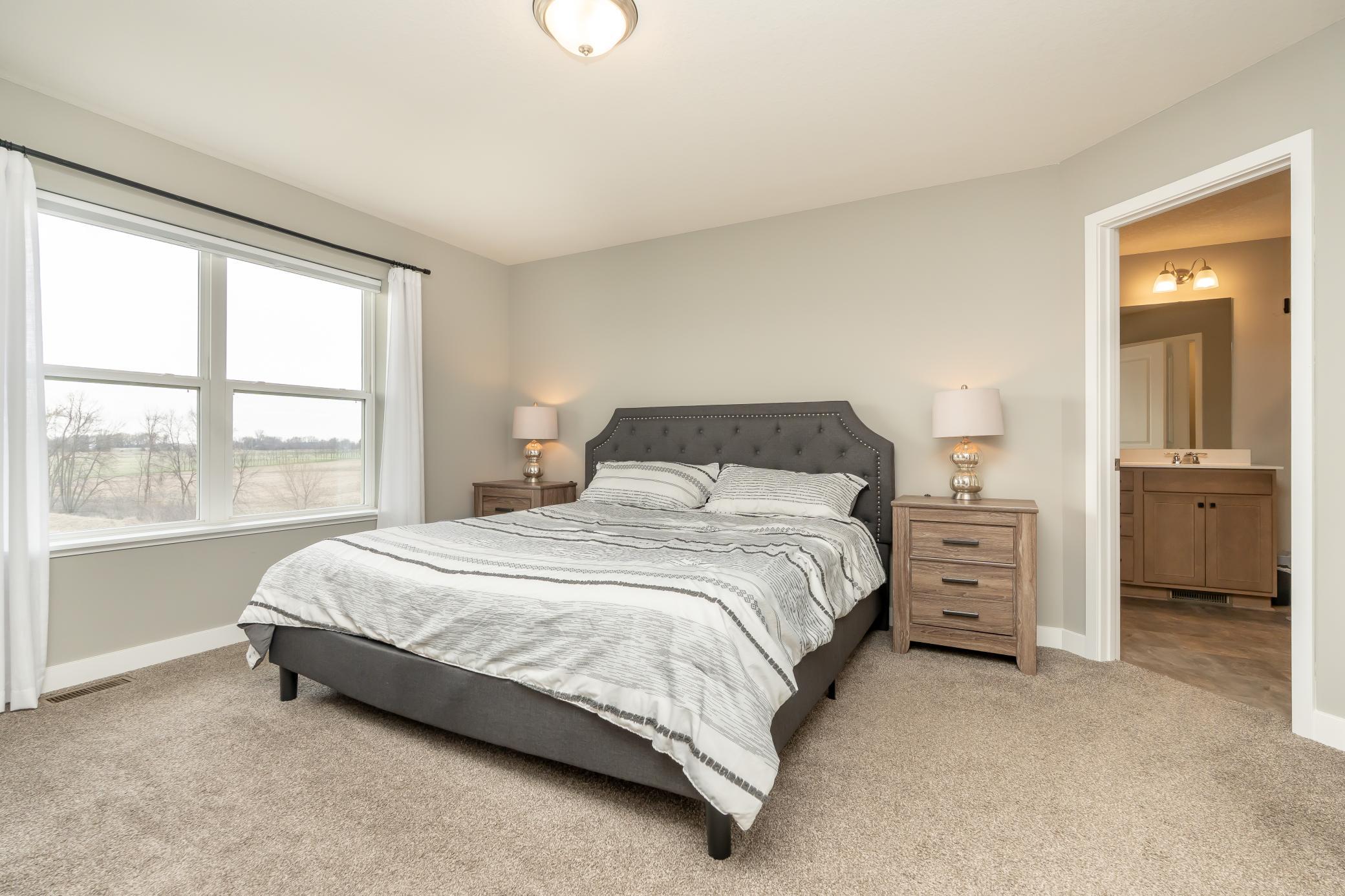 Primary bedroom with views overlooking wetlands