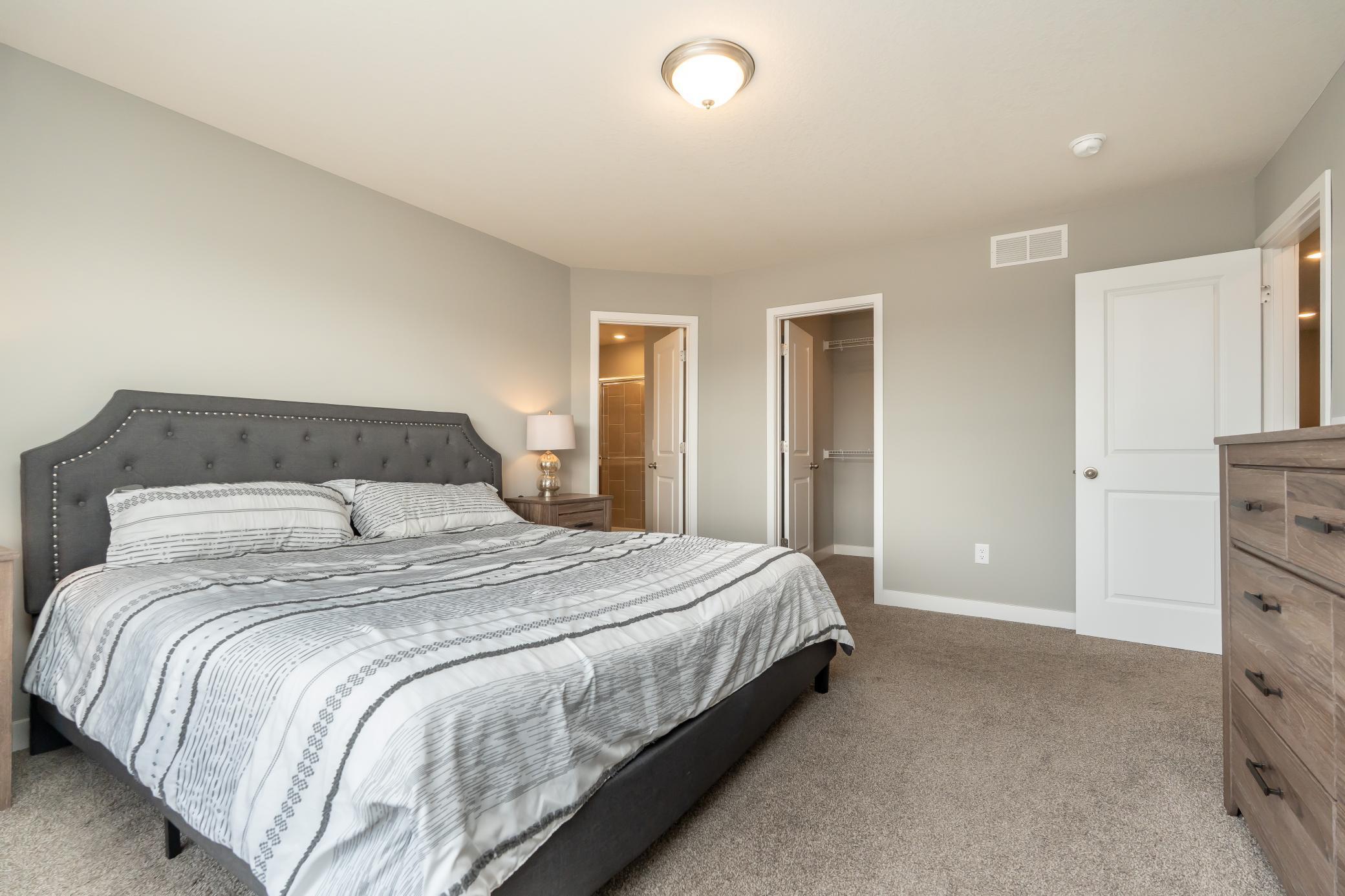 Primary bedroom that features 2 large and spacious walk-in closets