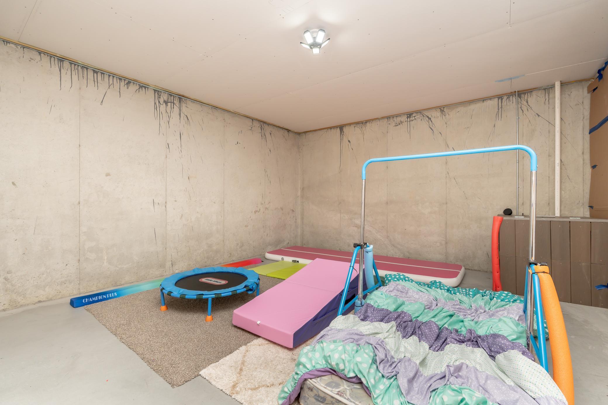 Huge storage area or kept as a kids gym space, or maybe a movie room