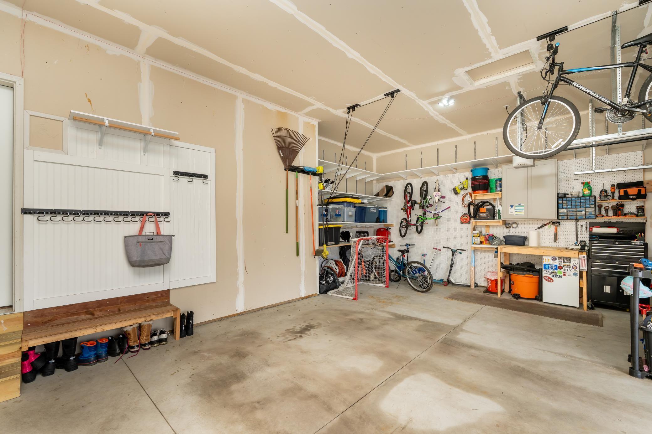 Second locker system/mudroom in the garage that is insulated and amazing storage and organization racks
