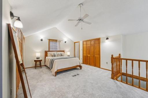 Private upper level owner’s suite with vaulted ceiling, plush carpeting, and excellent closet space.