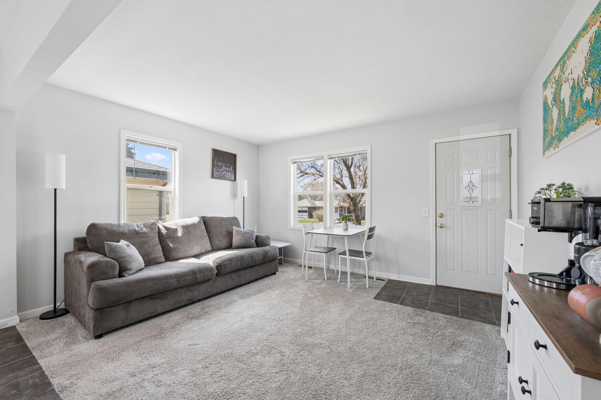 Large windows flood the room with natural light.