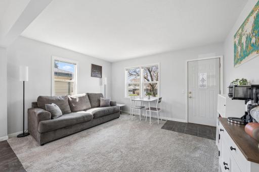 Large windows flood the room with natural light.