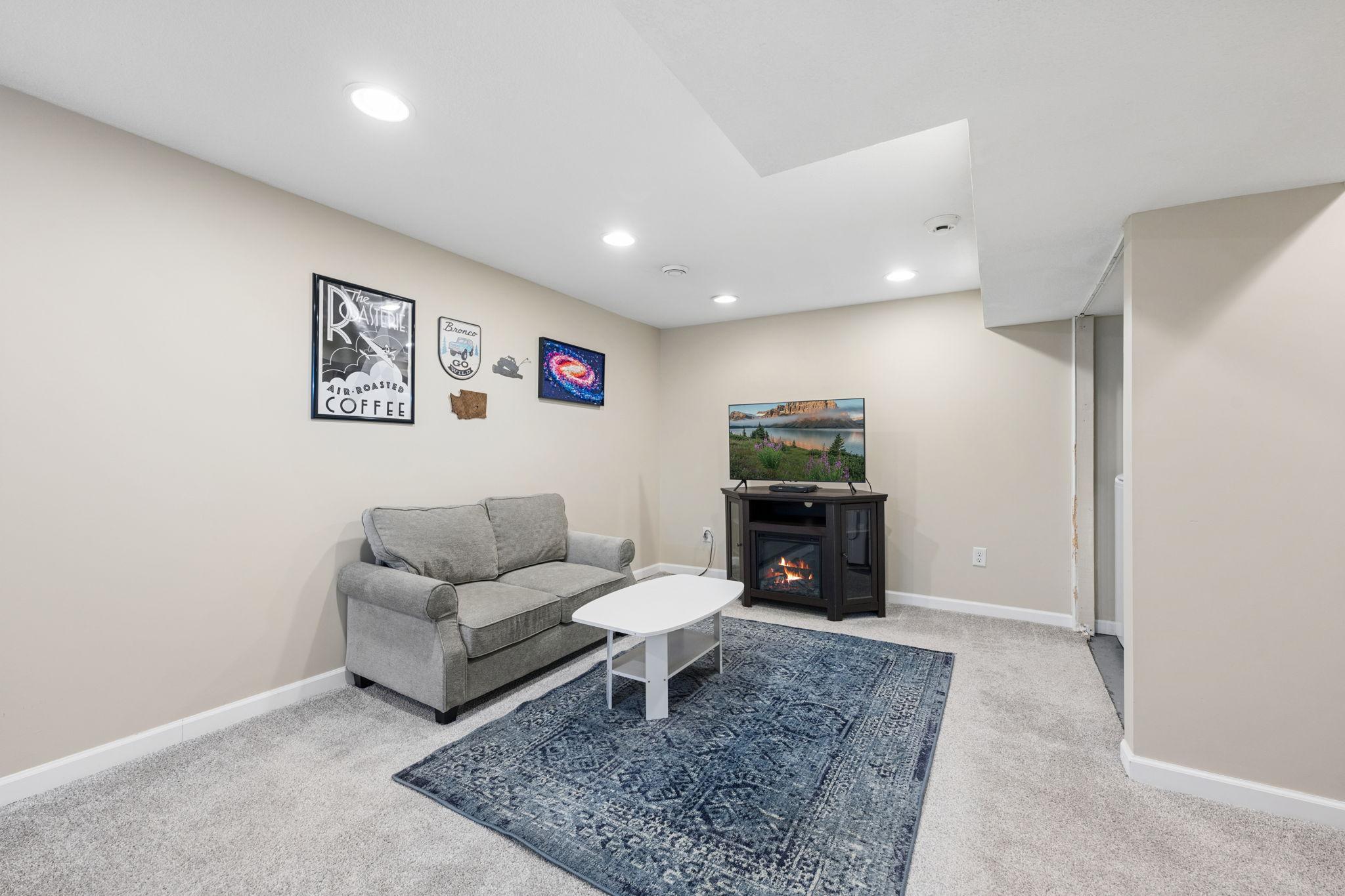 The lower level expands your living space with this large living room.