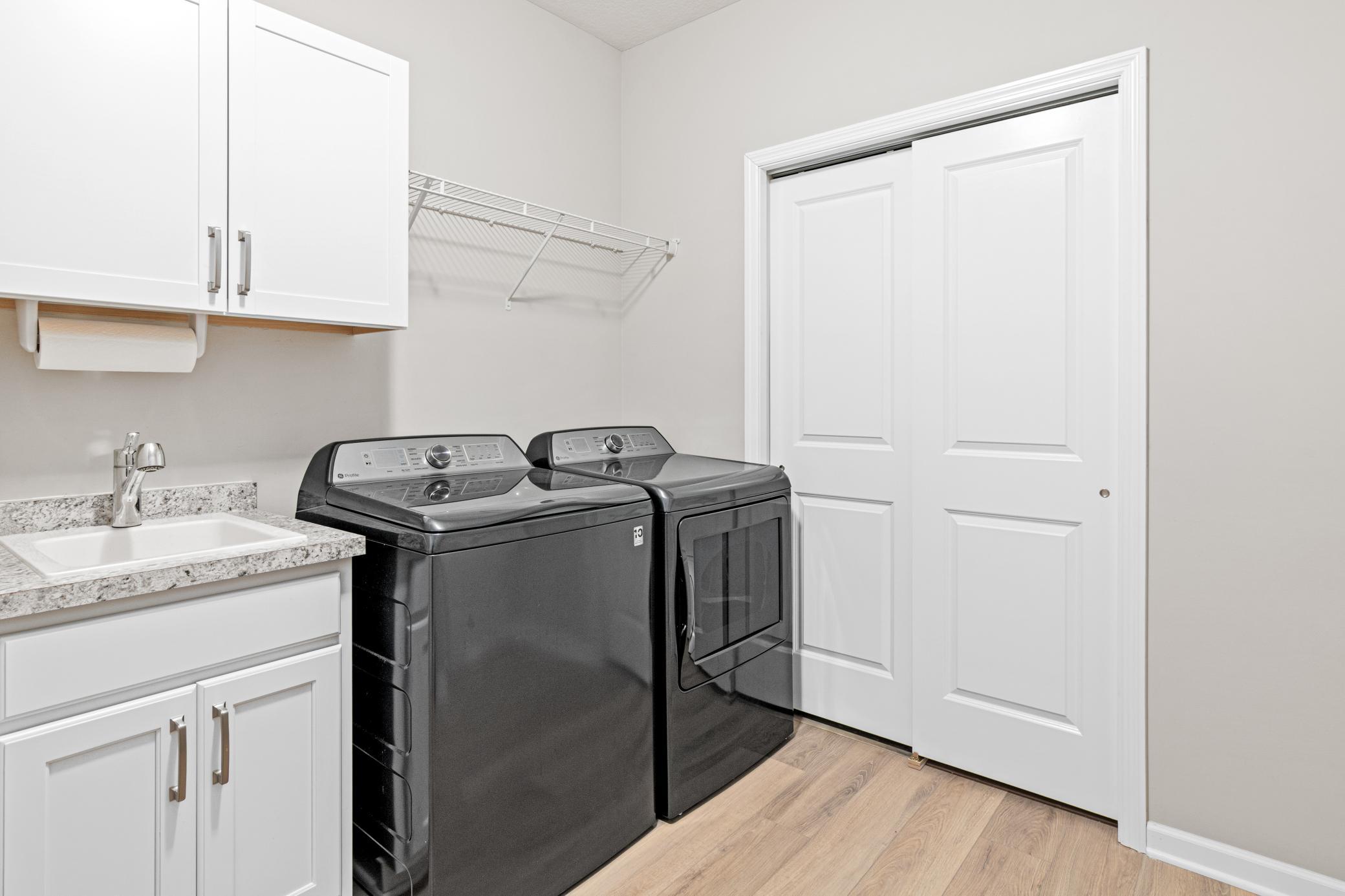 Added cabinetry, sink & under storage.