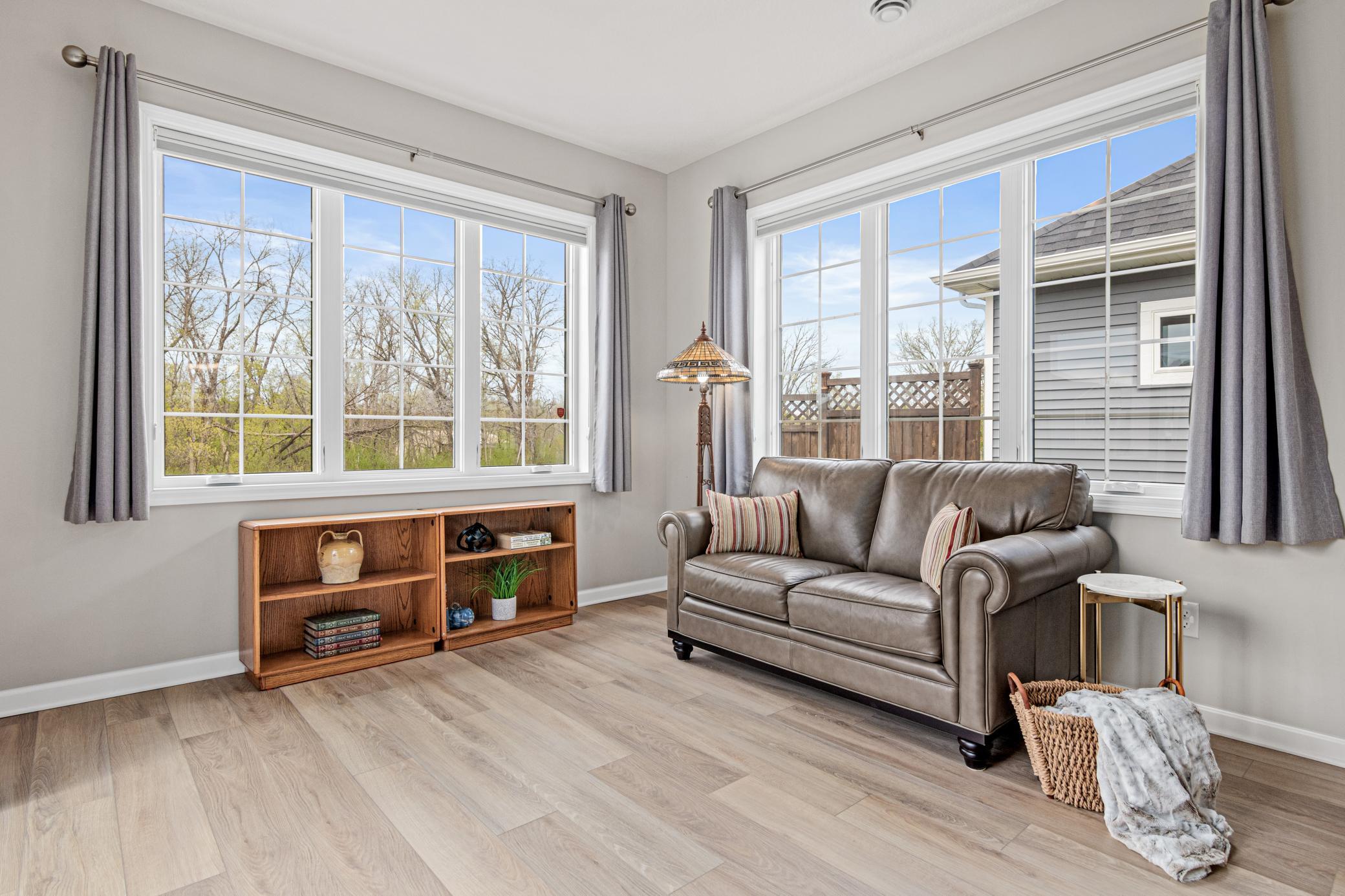Lightfilled sunroom just off of the dining area.