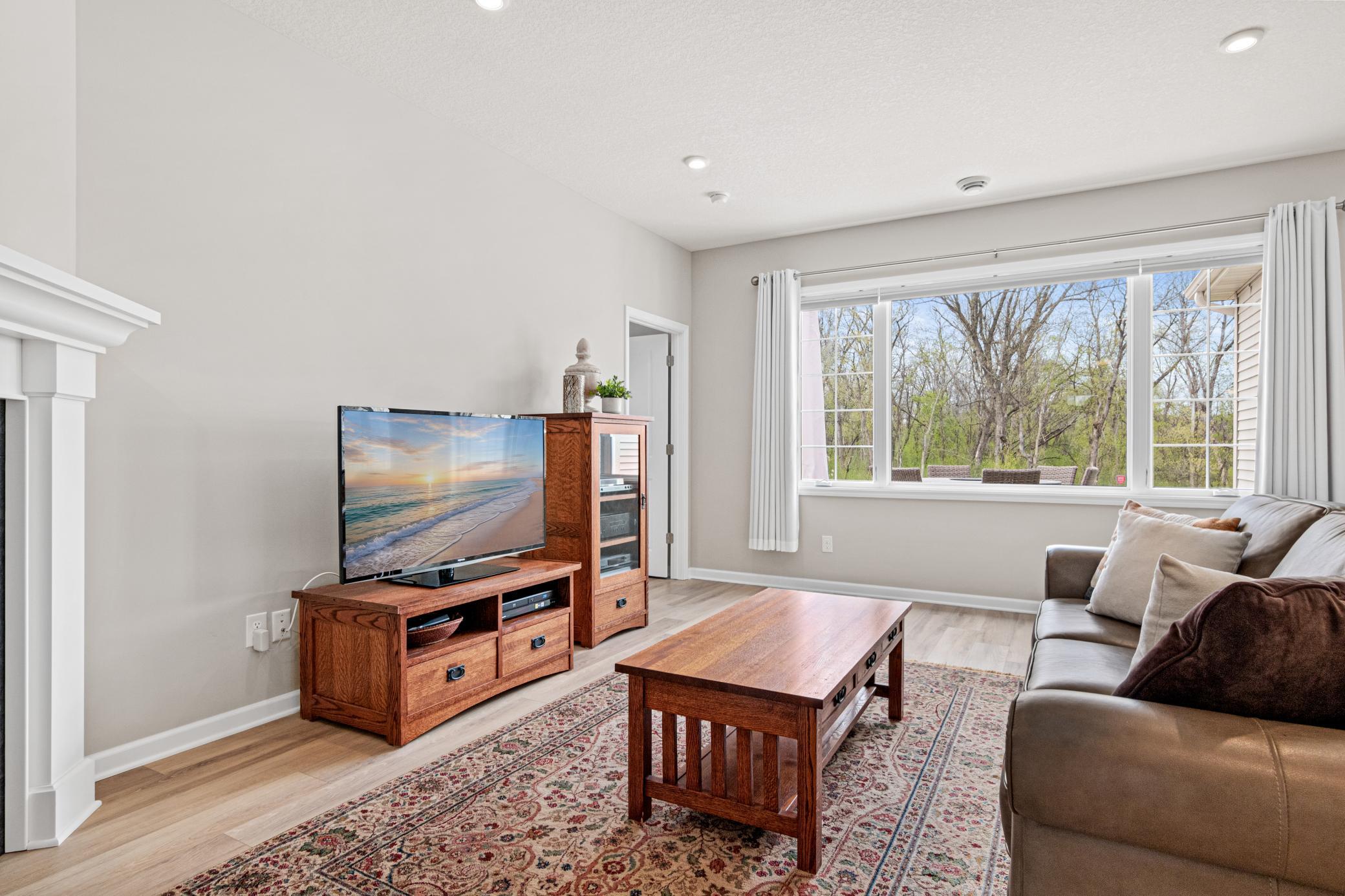 Custom window treatments throughout the whole home - Smith & Noble shades as well.