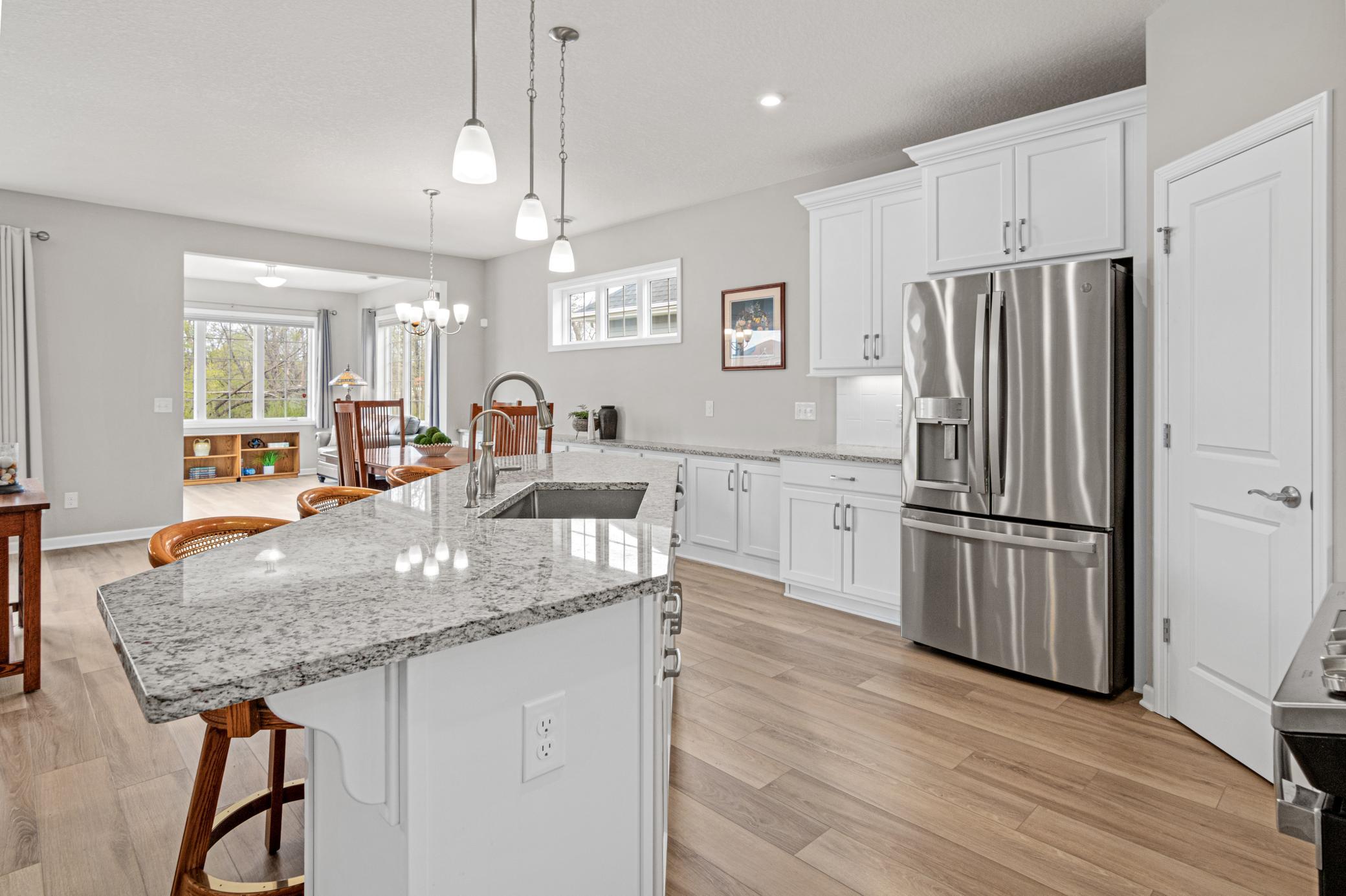 Extended cabinetry into the dining area with matching granite.