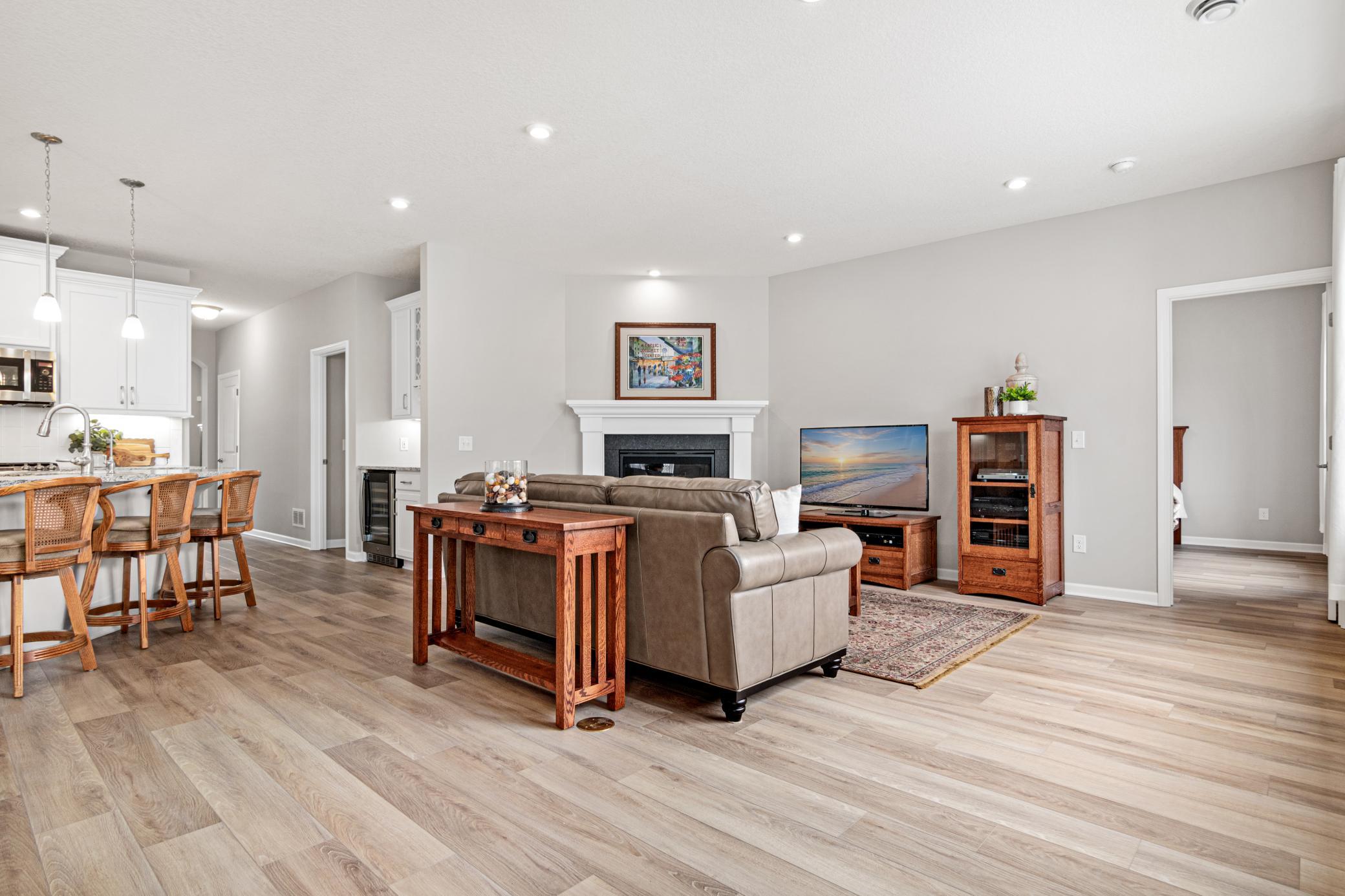 Luxury vinyl plank flooring throughout.