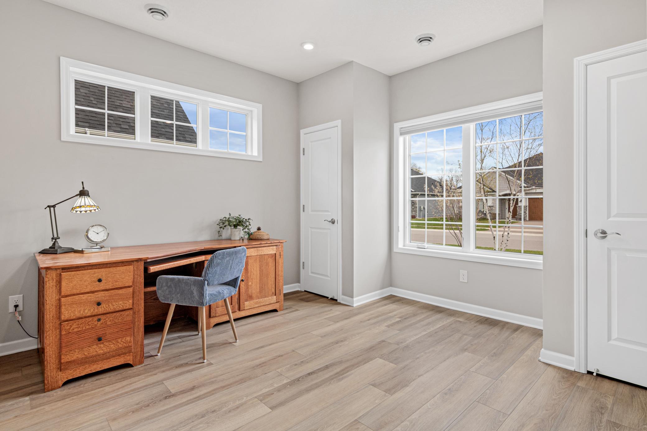 The 3rd bedroom, currently used as an office with 2 closets.