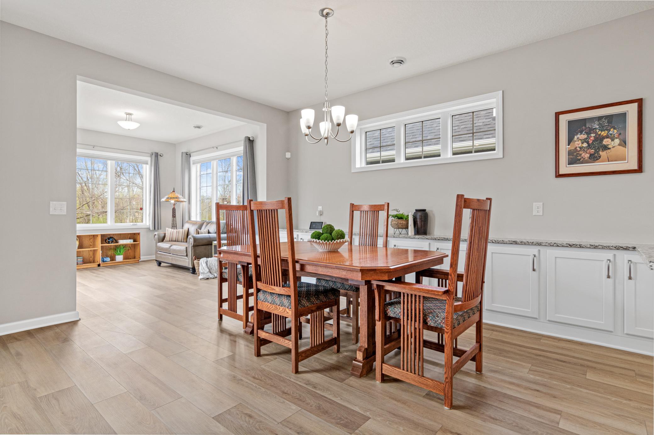 Large dining area with extra windows letting more sunlight in.