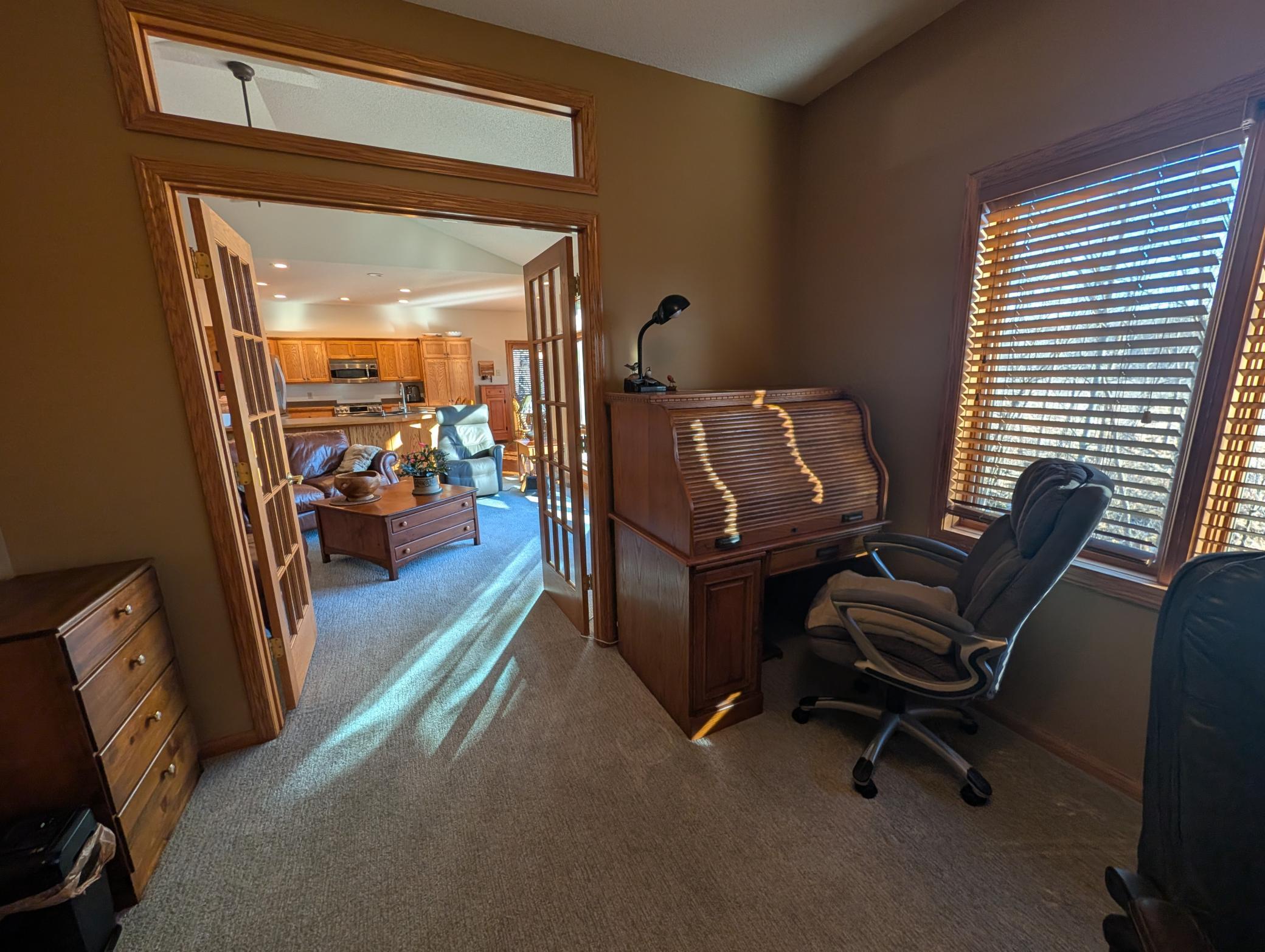 Study off of the great room with large windows overlooking the back yard and french doors for privacy