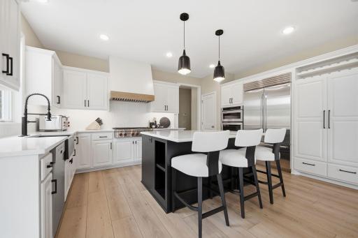 High end stainless steel appliances including Bosch Dishwasher, Subzero Fridge and Wolf Cooktop