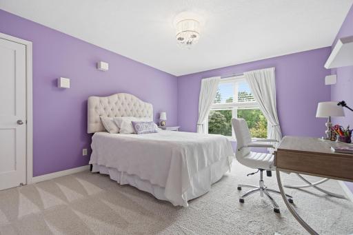 Bedroom with large window and ample closet
