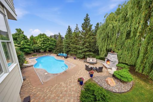 The natural shaped pool makes the yard feel tranquil as if you are in a Paradise Oasis!