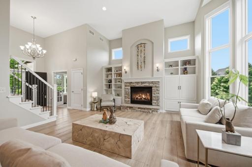 A stately fireplace with custom built-ins. Notice the windows above the built-ins for more natural light