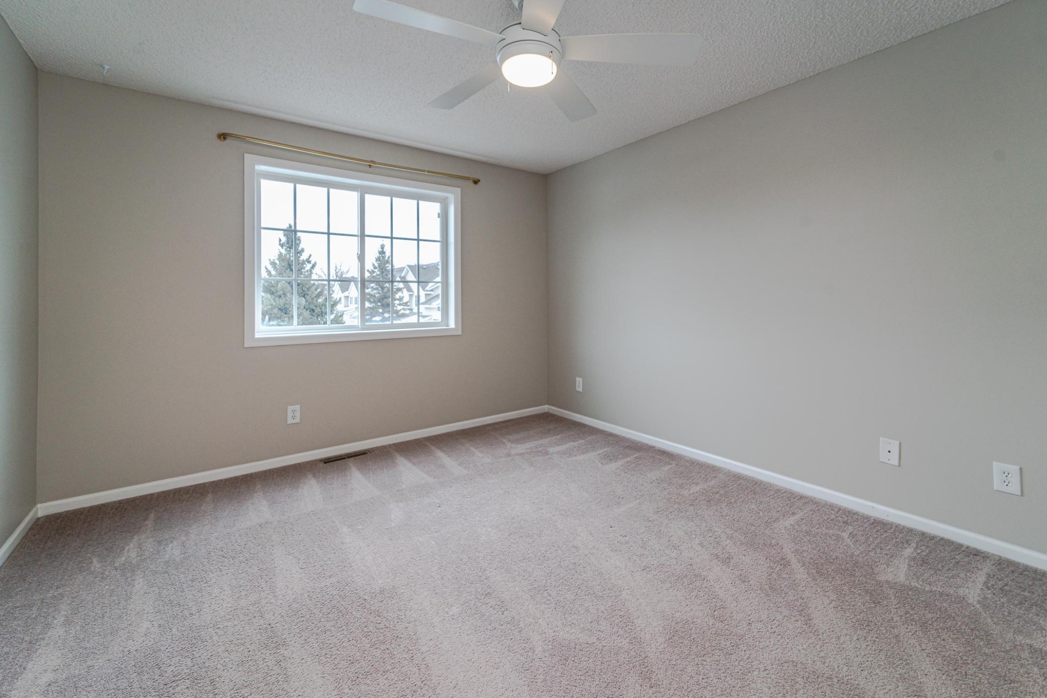 This is one of two upper level bedrooms on the second floor. This room has a fan and southern light.