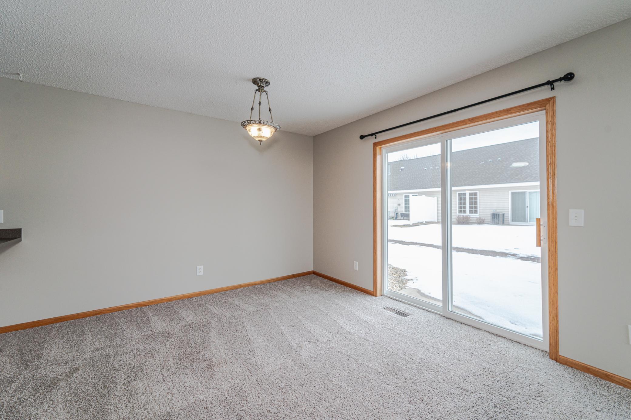 There is room here for your dining room table, and some barstools along the kitchen countertop.