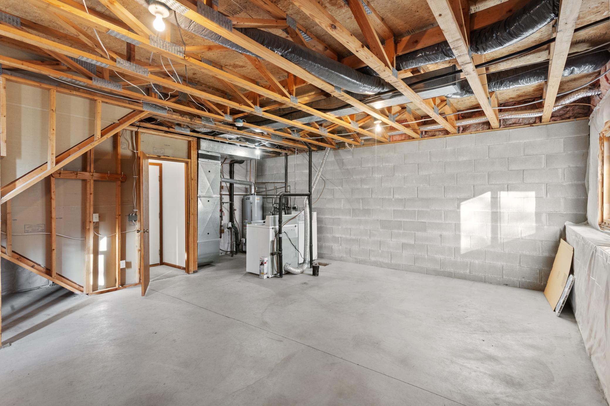 IMG_18Lower level: unfinished family room area and rough in for bathroom (can also add a 3rd bedroom)06.jpg