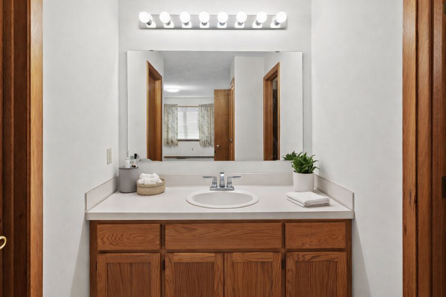Main level: Primary bedroom vanity station (virtually staged)