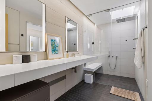 Owner's suite bathroom has custom italian tile with heated floors and high-flow shower.