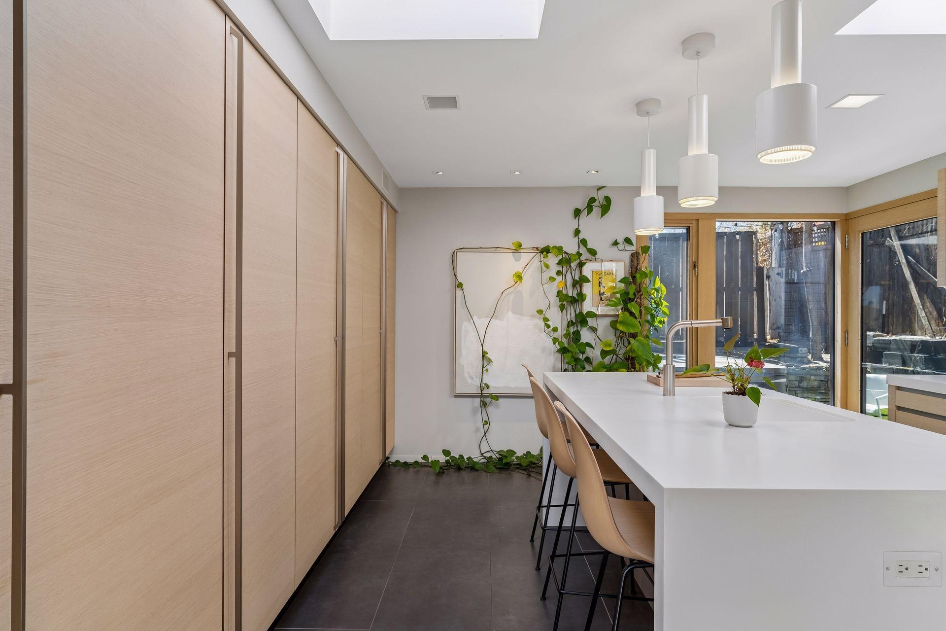Contemporary, minimalist kitchen has Italian Valcucine cabinets.