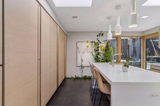 Contemporary, minimalist kitchen has Italian Valcucine cabinets.
