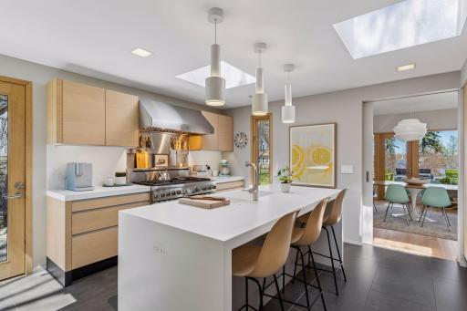 Contemporary, minimalist kitchen with views of the lake and Minneapolis skyline.
