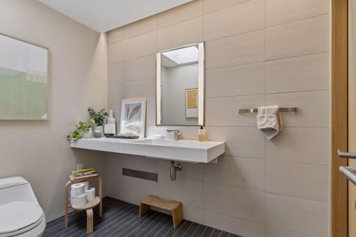 Guest's bathroom has custom italian tile with heated floors.