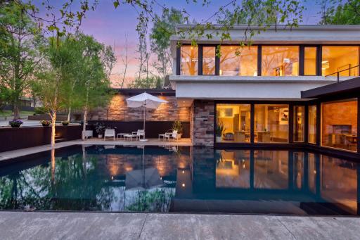 Striking 40-by-20-foot reflecting pool sets a serene tone for the entire property.