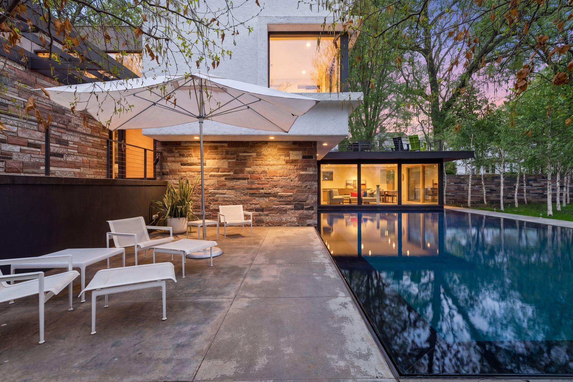 Striking 40-by-20-foot reflecting pool sets a serene tone for the entire property.