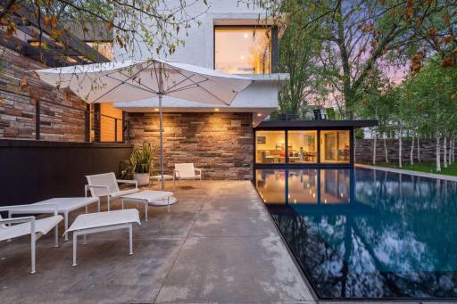 Striking 40-by-20-foot reflecting pool sets a serene tone for the entire property.