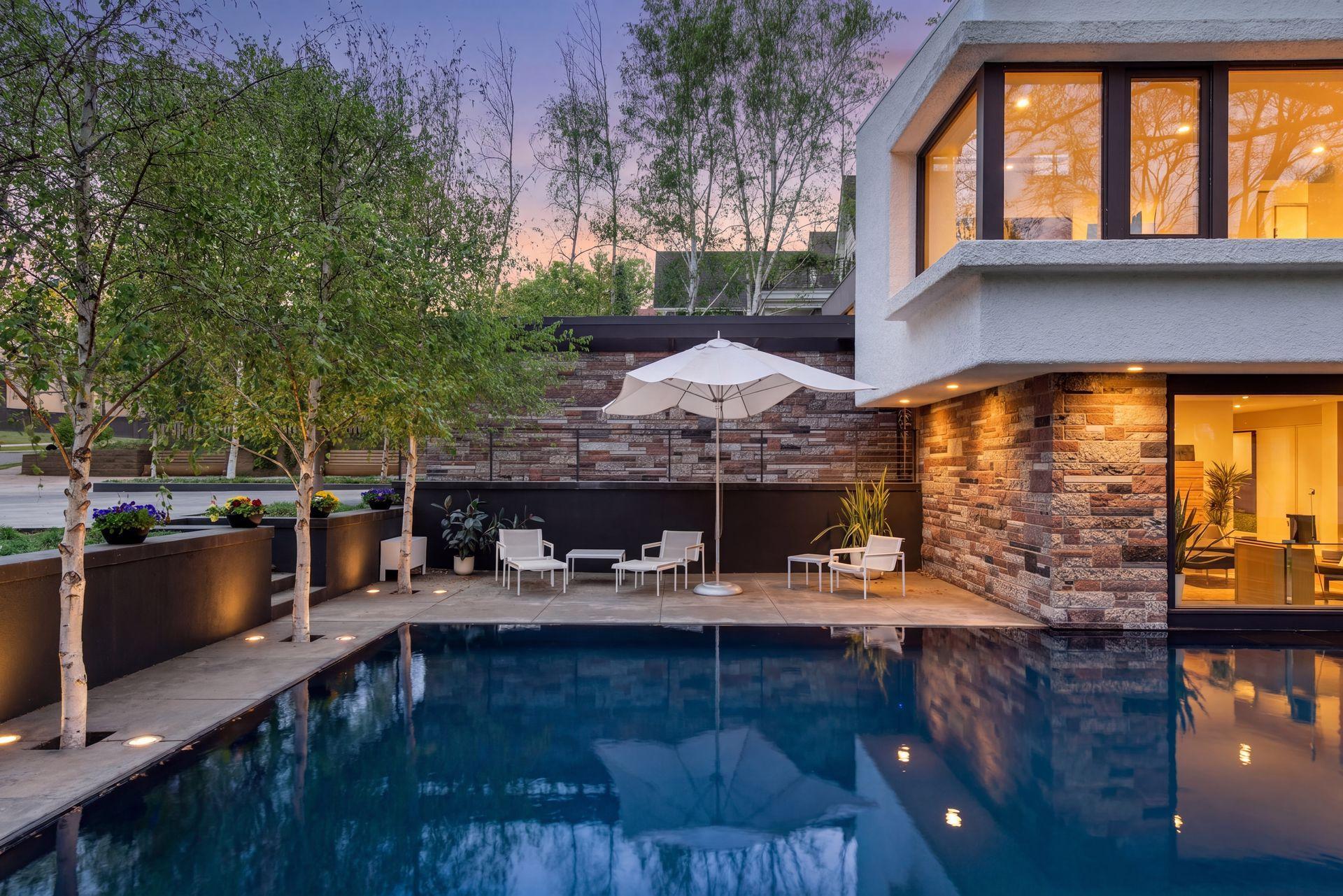 Striking 40-by-20-foot reflecting pool sets a serene tone for the entire property.