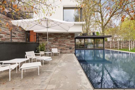 Reflective 20x40 pool (18 inches deep) and patio set back from the street.