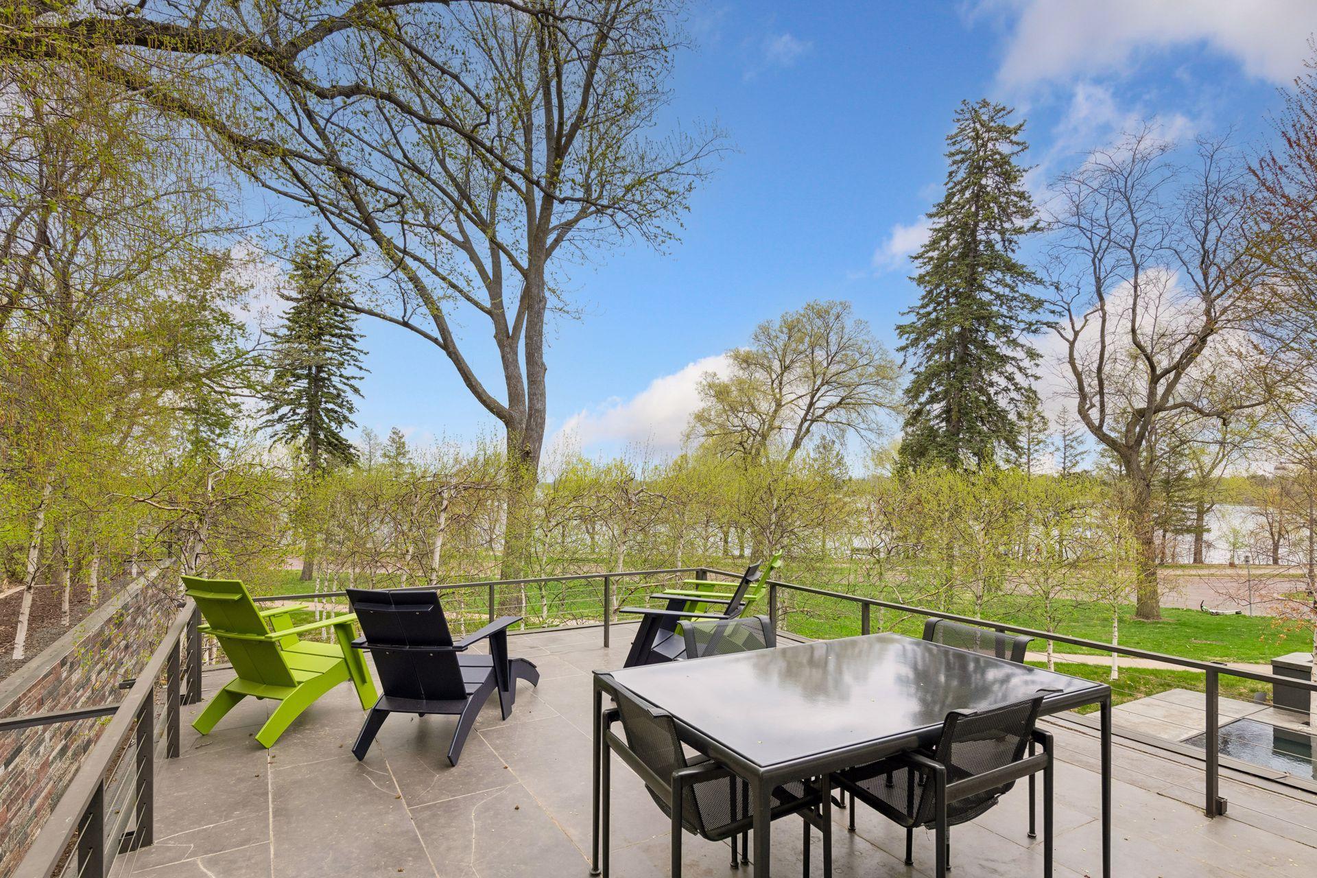 Breathtaking views of reflective pool, birch trees, Minneapolis skyline and Bde Maka Ska.