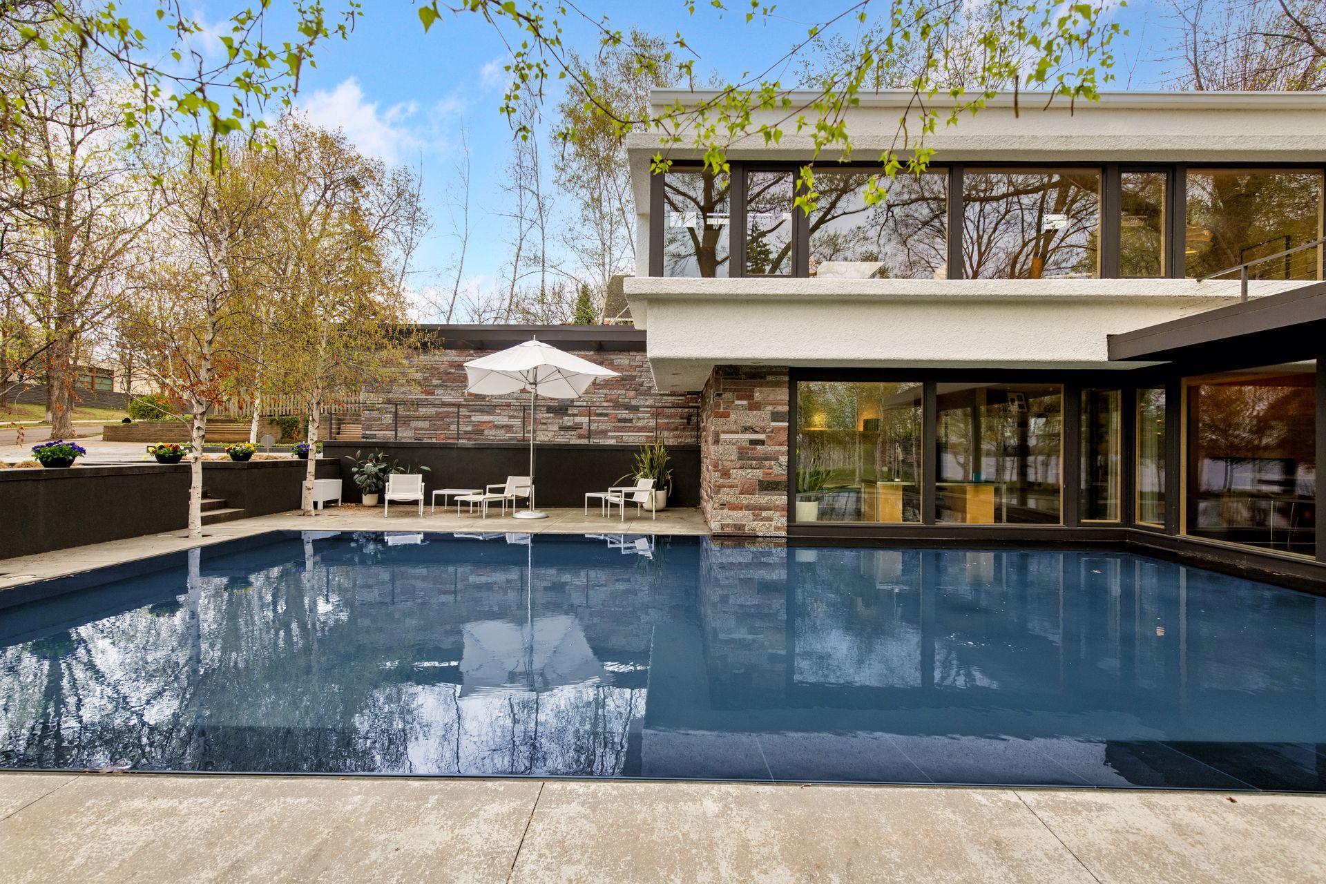 Striking 40-by-20-foot reflecting pool sets a serene tone for the entire property.