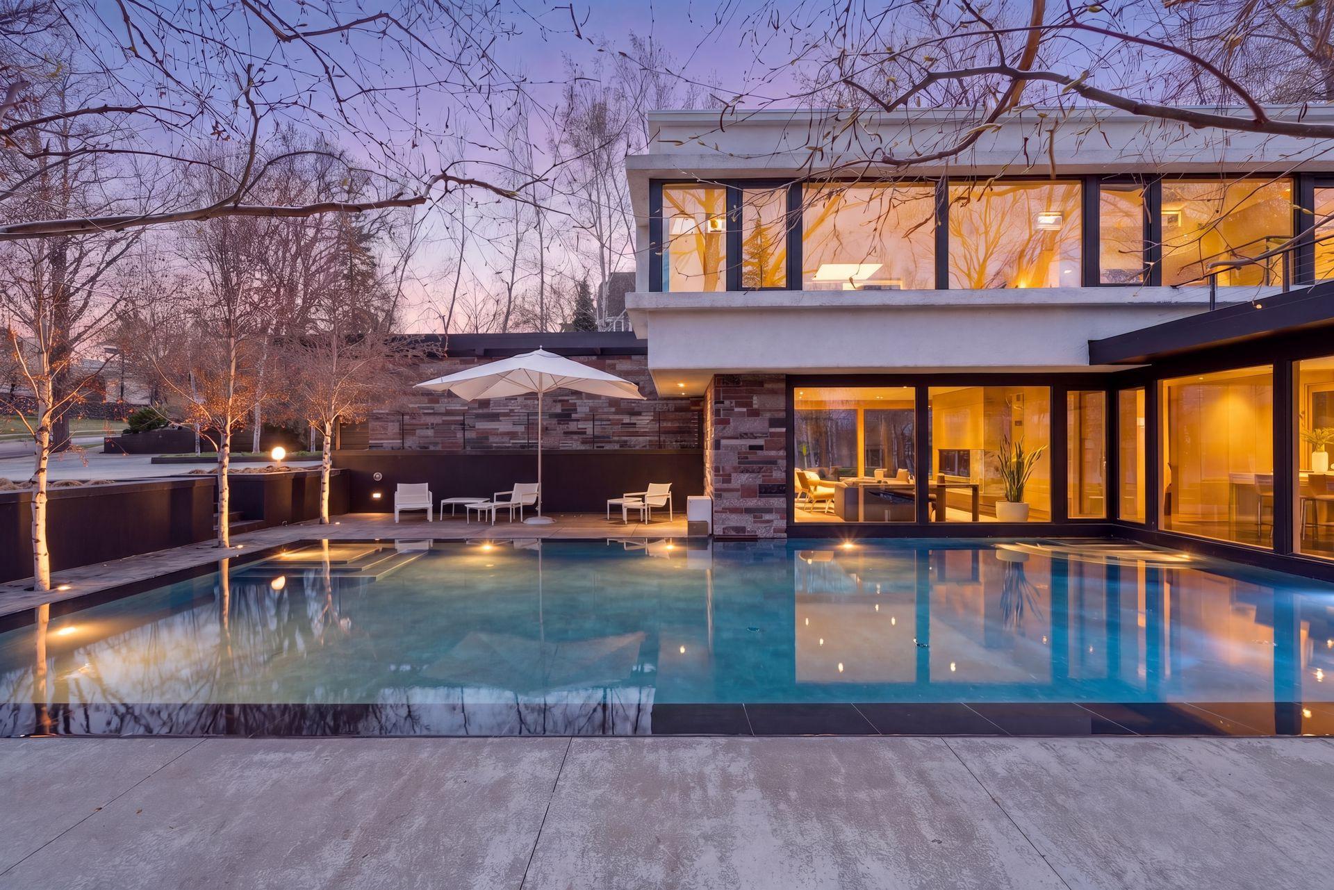 Striking 40-by-20-foot reflecting pool sets a serene tone for the entire property.