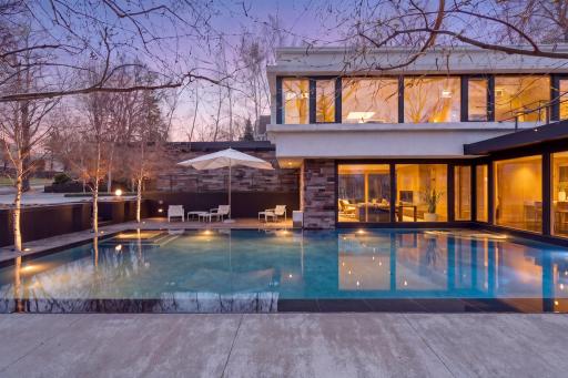 Striking 40-by-20-foot reflecting pool sets a serene tone for the entire property.