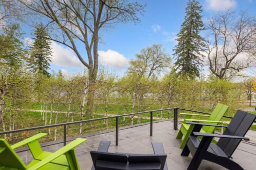 Breathtaking views of reflective pool, birch trees, Minneapolis skyline and Bde Maka Ska.