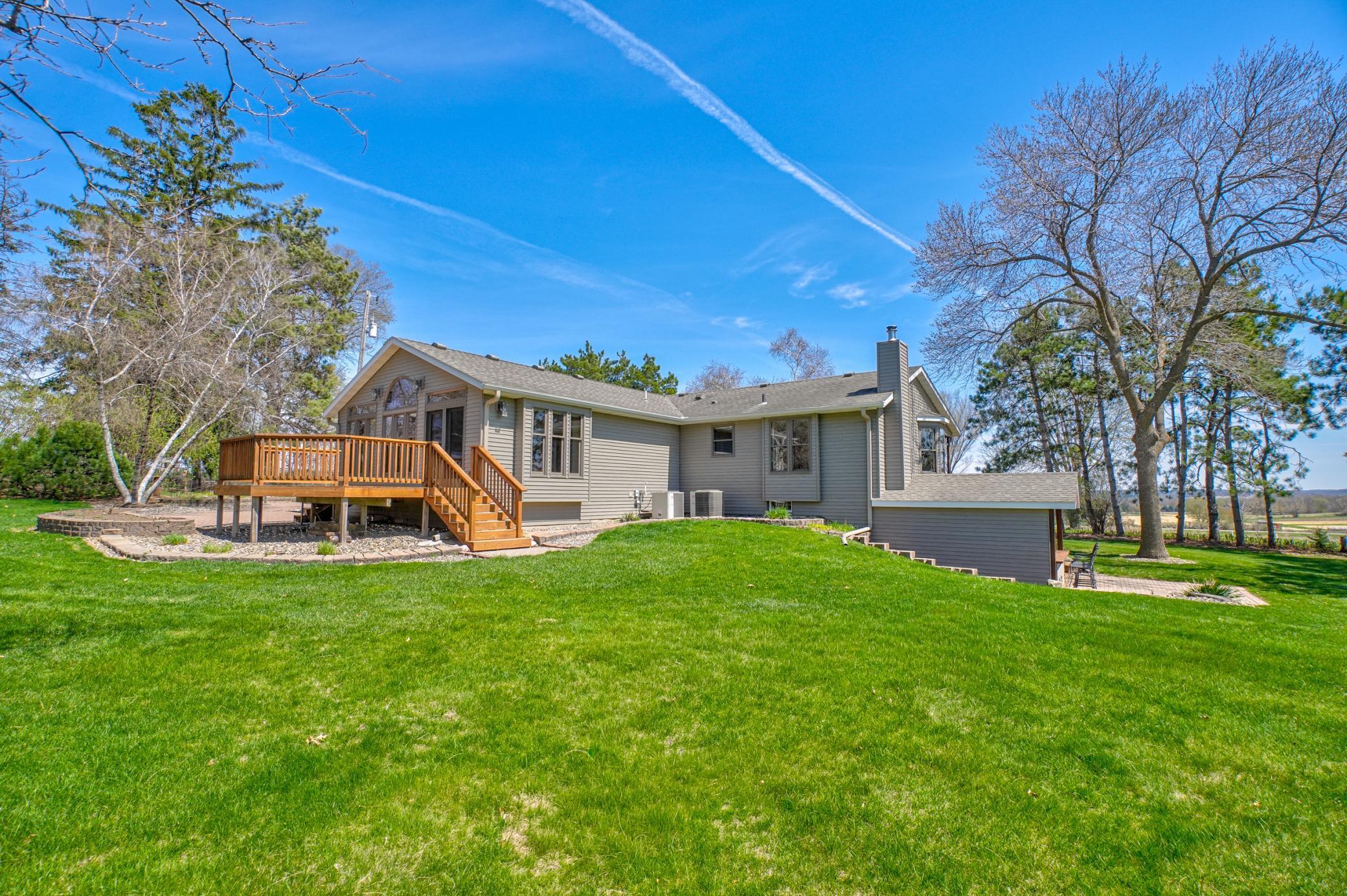 A cedar deck, north-facing paver patio, and open yard create inviting spots for morning coffee, evening sunsets, and everything in between.