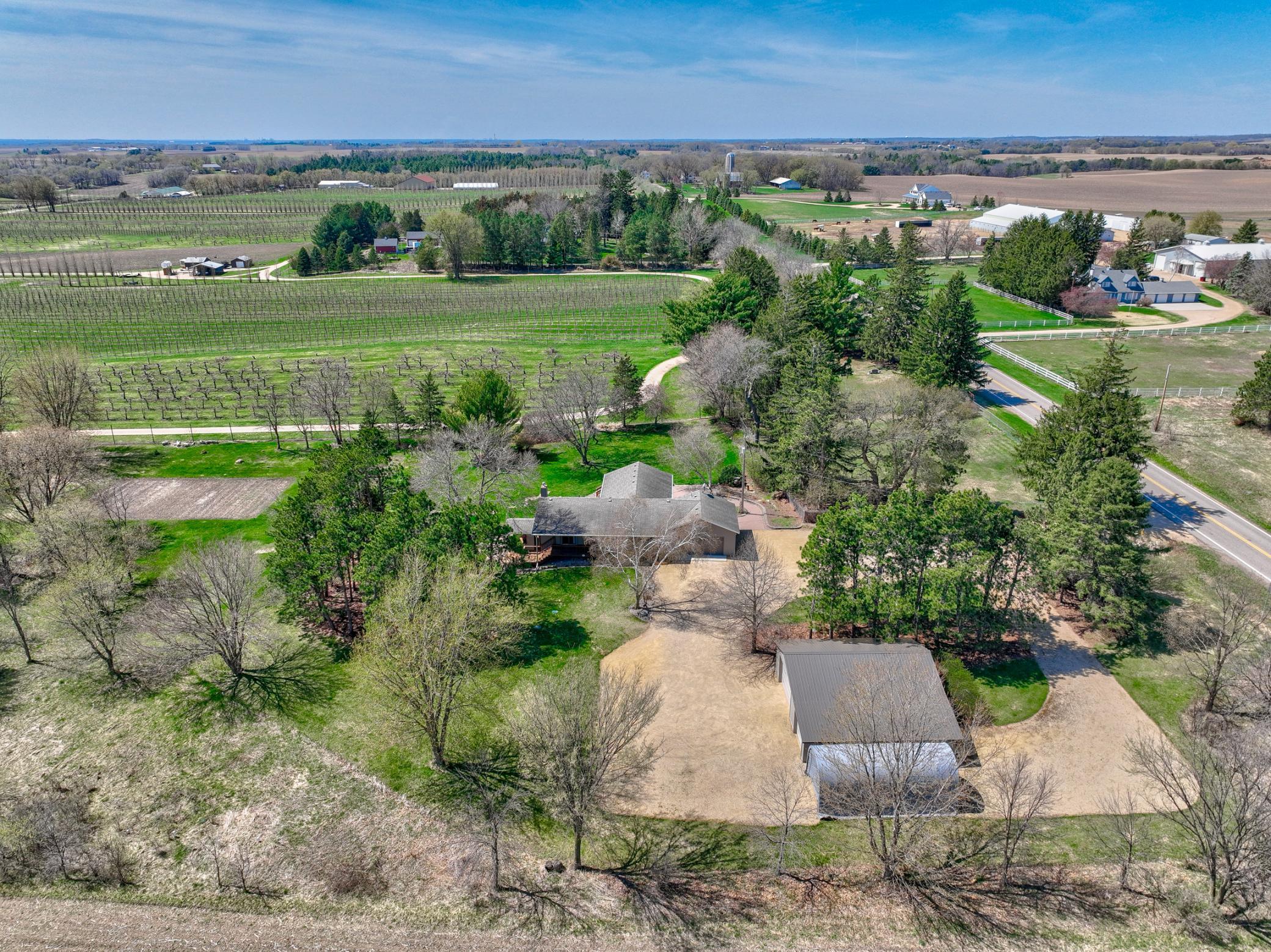 The property includes a 40x40 outbuilding, plus a 14x32 hoop shed, offering opportunities for animals, hobbies, or storage.
