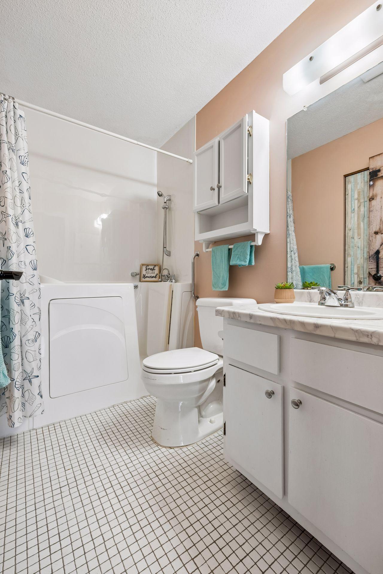 This walk-in shower /tub combination is handicapped accessible.