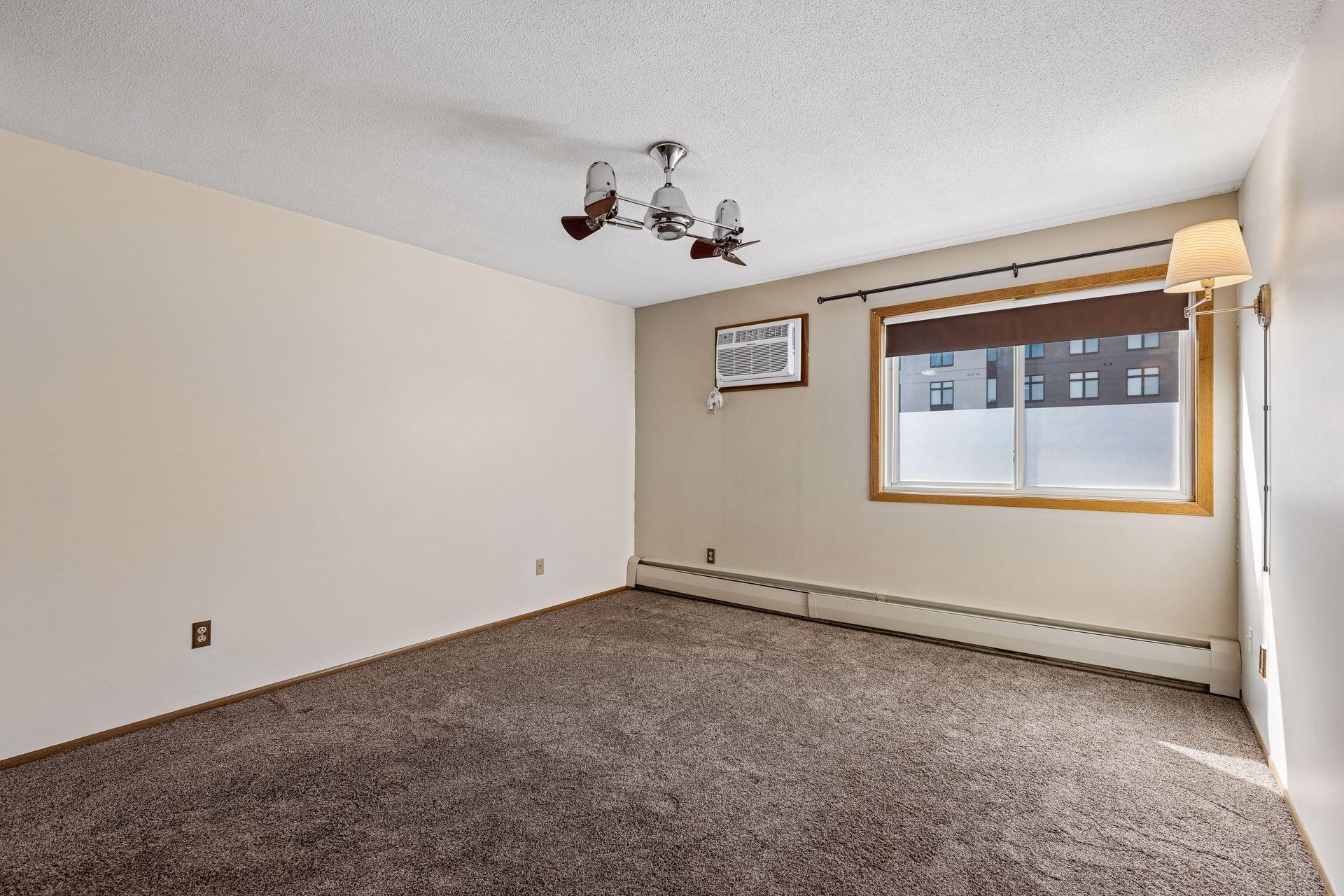 Primary bedroom with ensuite bathroom and two closets.