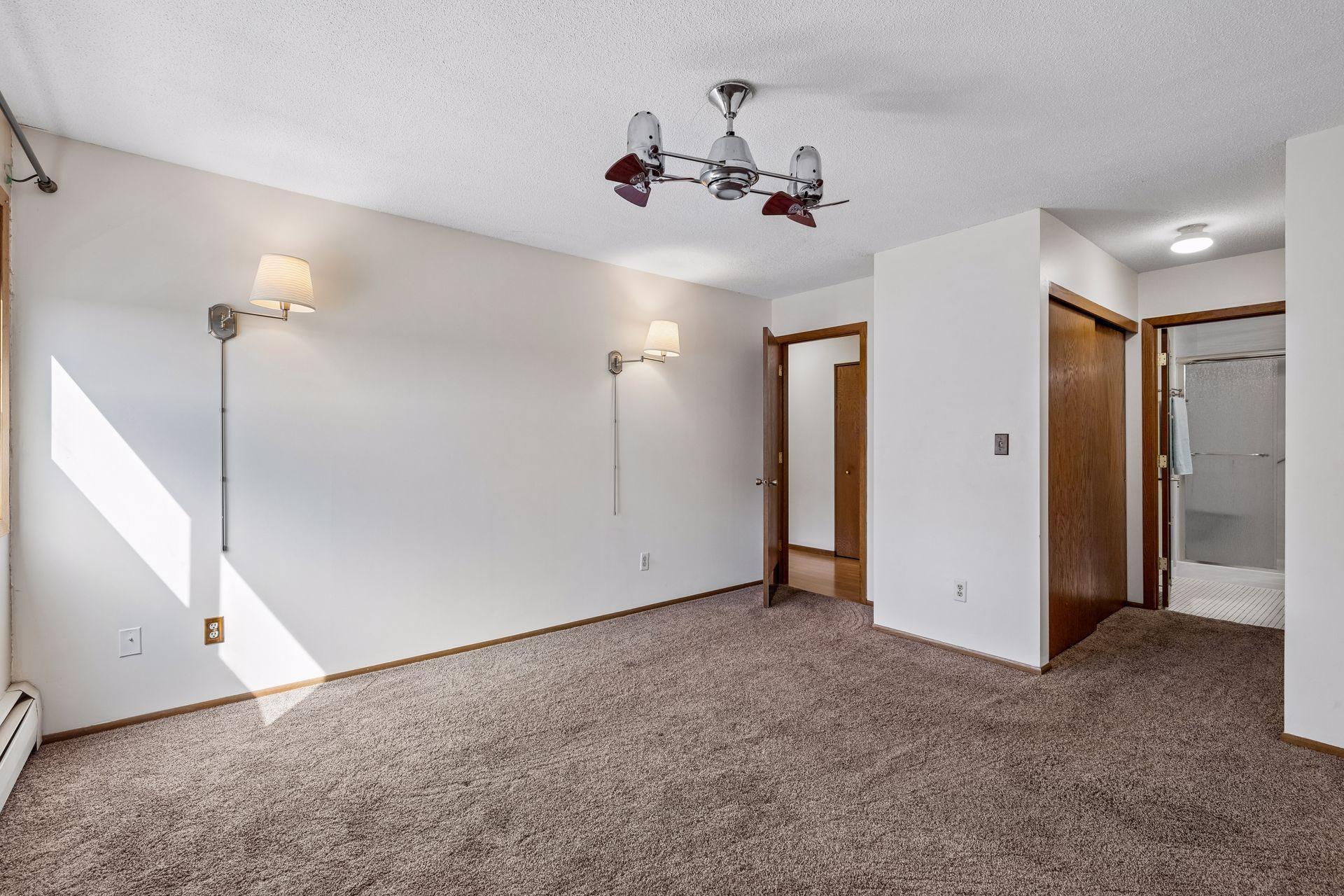 Primary Bedroom with door on right leading the private 3/4 Bathroom.