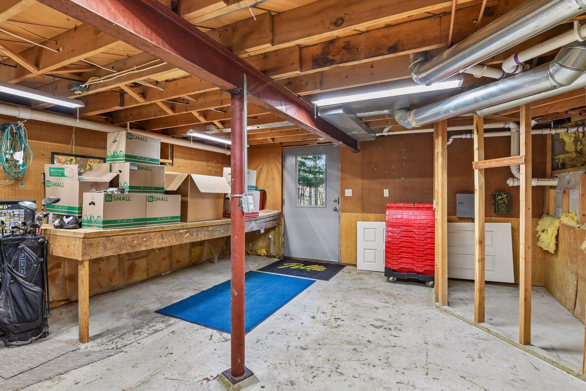 Lower Level Addl Storage & Workshop Room that walkouts out to the West Side of the home where there is a paved driveway.