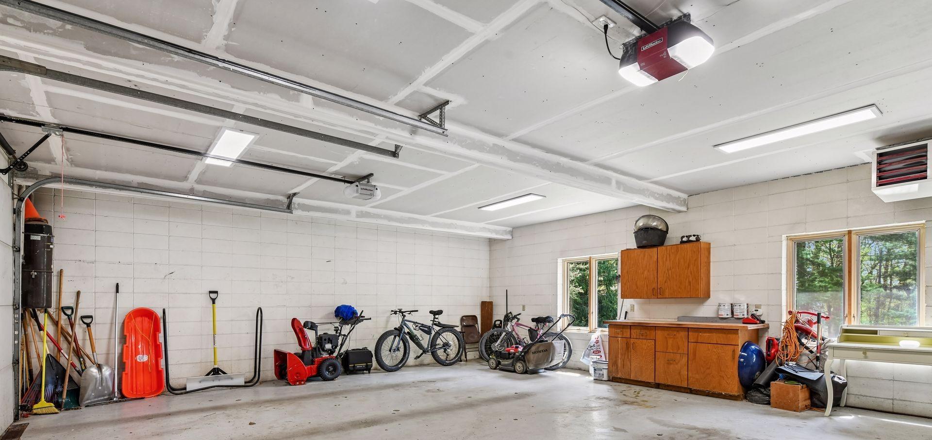 Extra wide (29.1 feet) garage that is almost the minimum (30 feet+) to make it a 3 stall garage. Plenty of natural light for all time of the day.