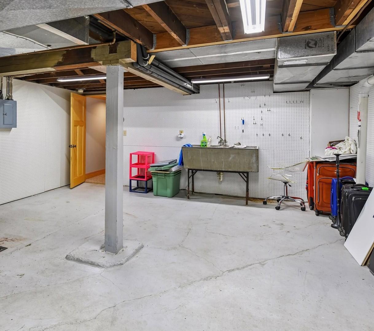 Lower Level Storage Room & Newer Radon Mitigation System