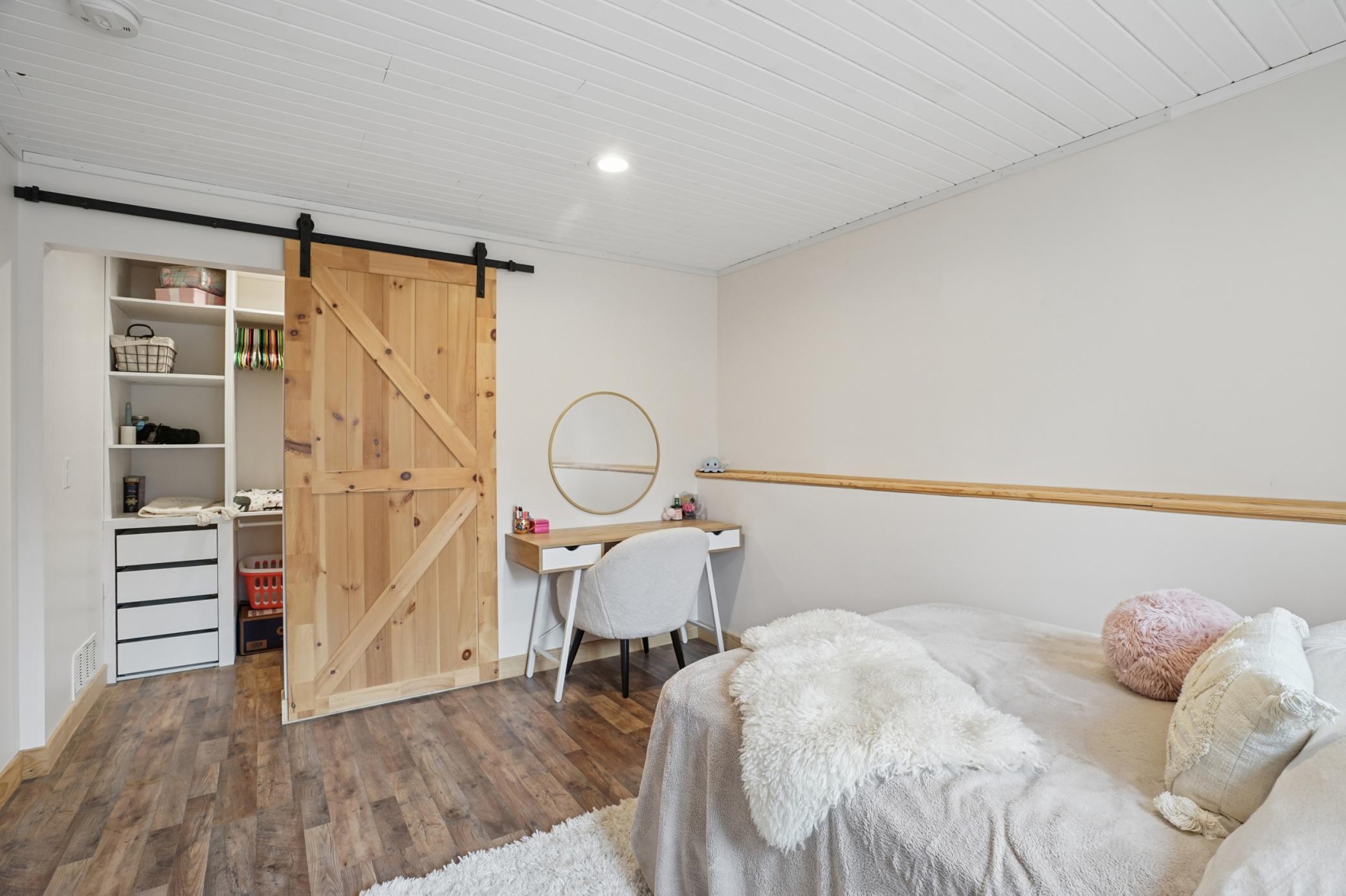 Lower level bedroom #5! Offers privacy, space, and an awesome closet!